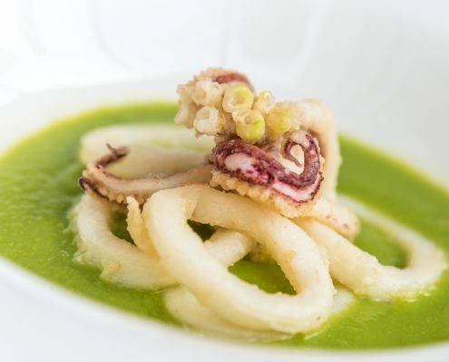 Italy, Liguria, baked octopus with pea sauce served in a little special restaurant near to the Cinque Terre